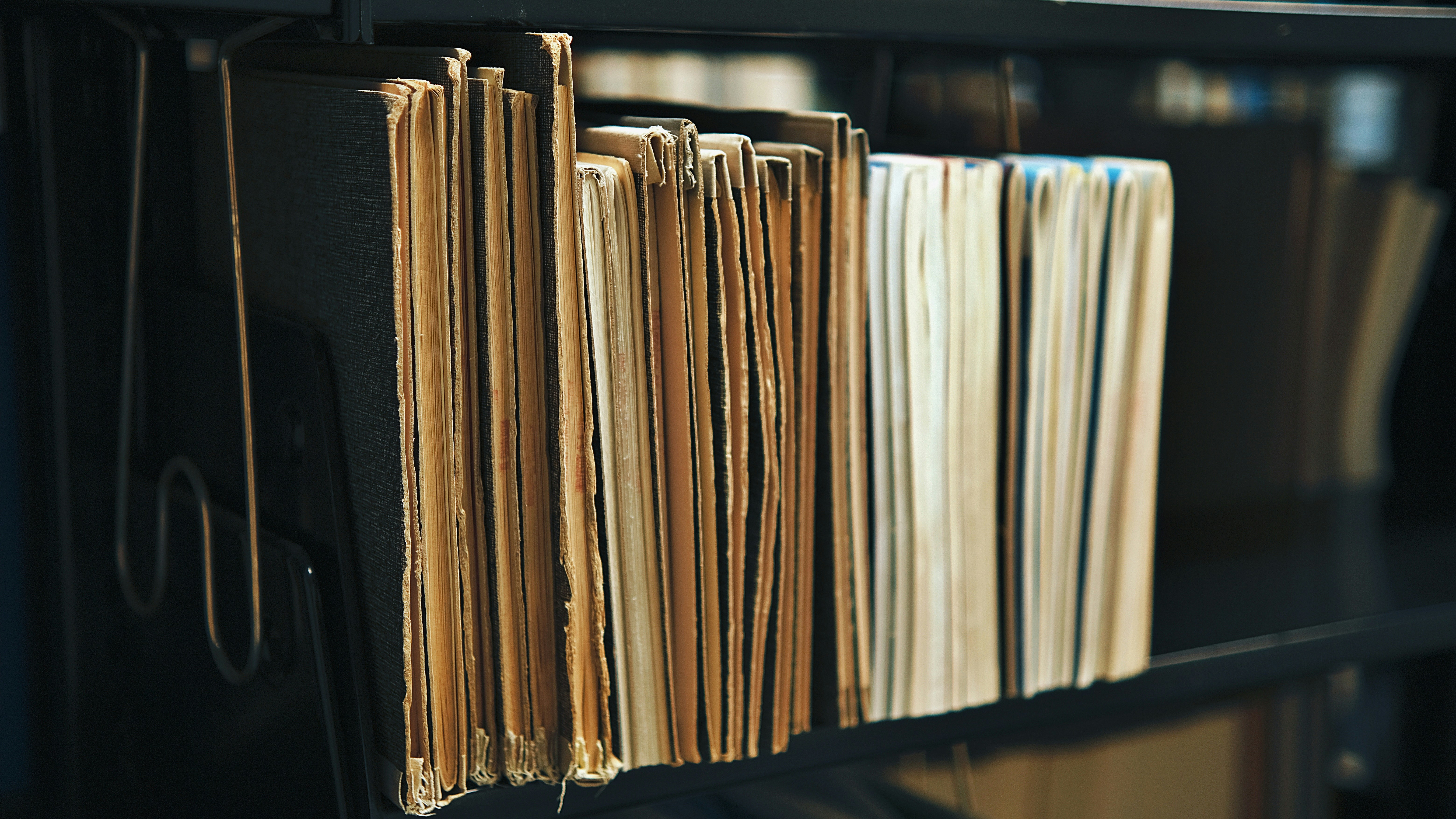 Old files and books on a shelf.