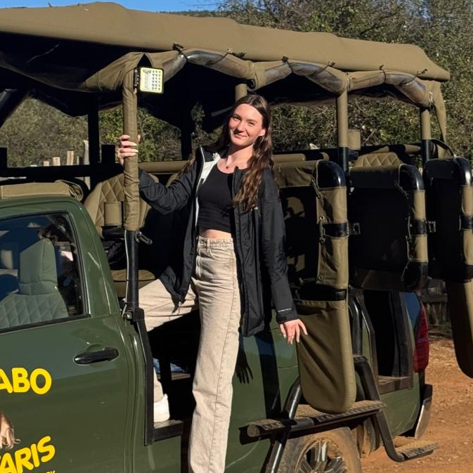 WOman sitting in safari SUV