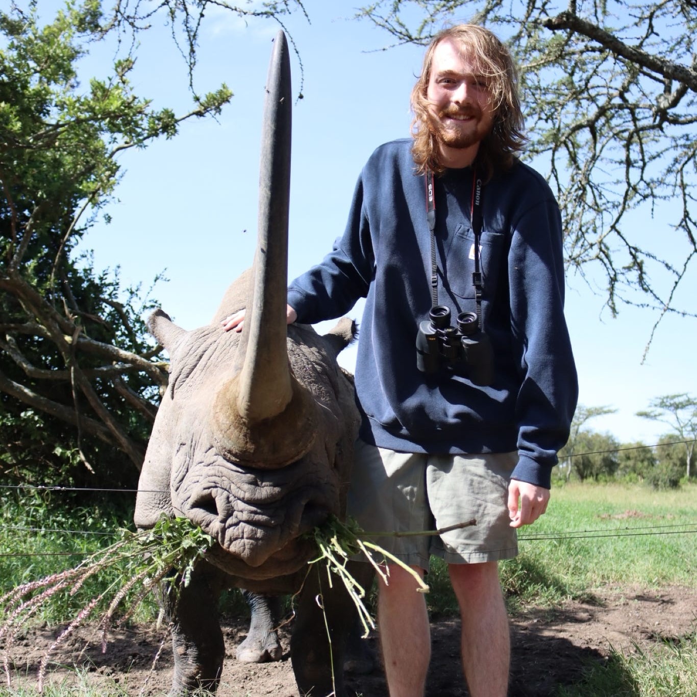 Man with black rhino