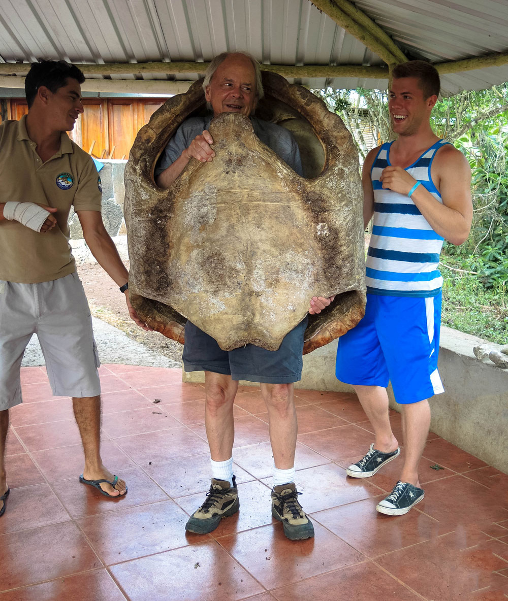 Dick Hill standing in a tortoise shell