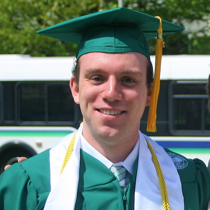 Portrait of Sam Decker wearing graduation hat and gown